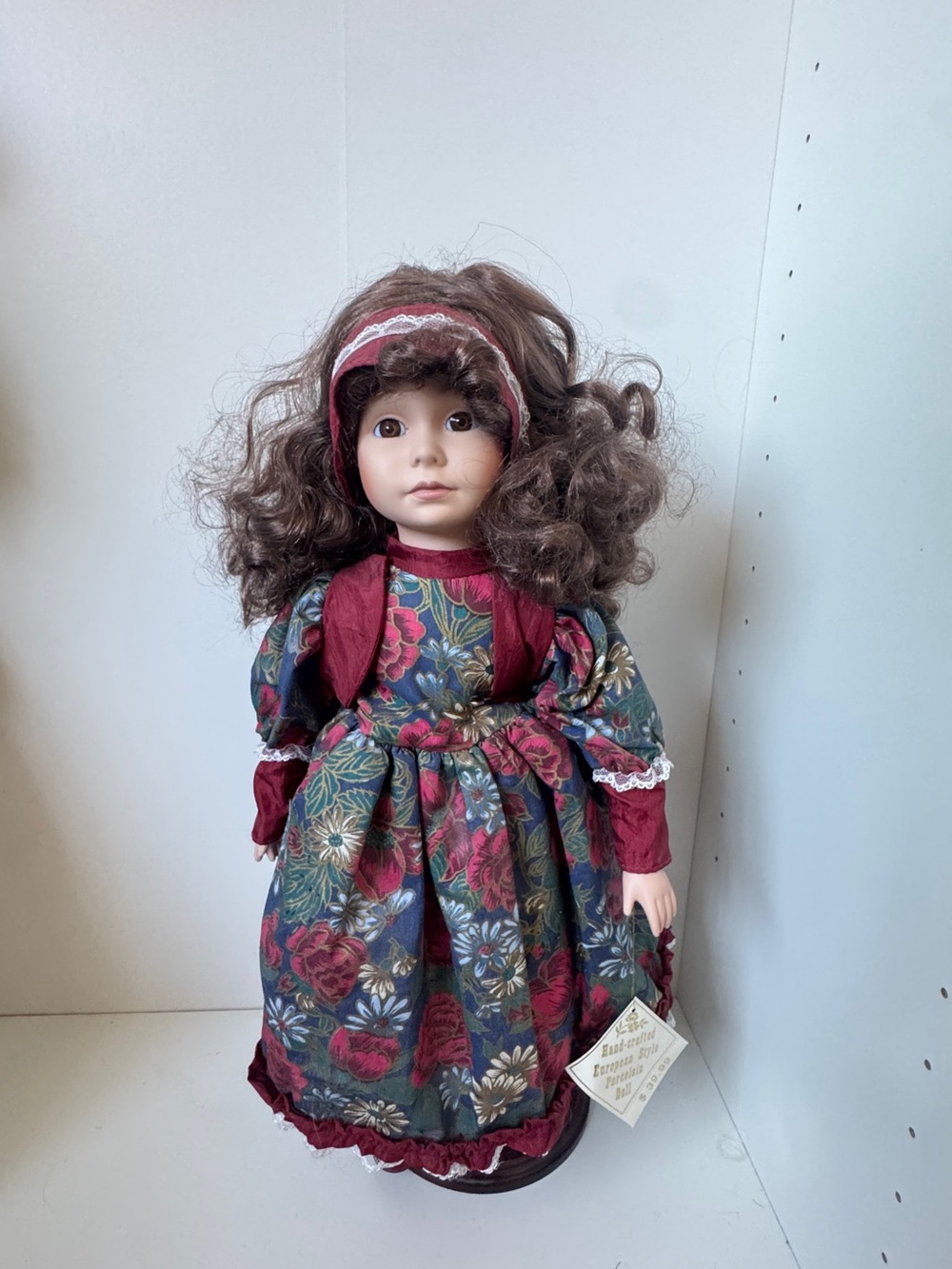 Porcelain-Style Doll in Burgundy Floral Dress